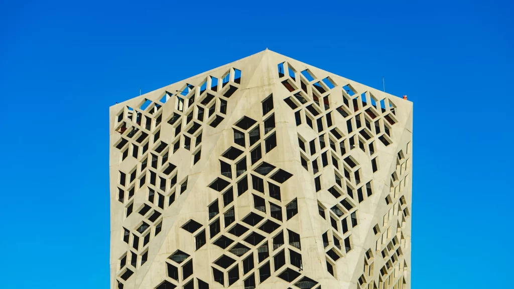 Modern  building under a clear blue sky, a landmark that could be near leading recruitment agencies