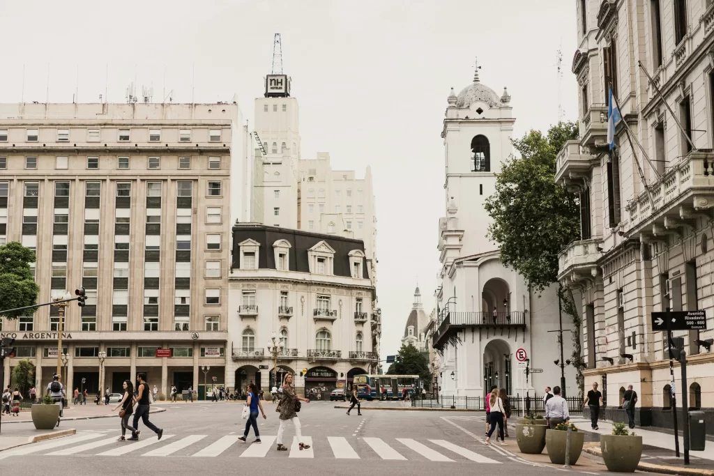 Street view of Buenos Aires with classic architecture, showcasing the bustling urban life near recruitment agencies.