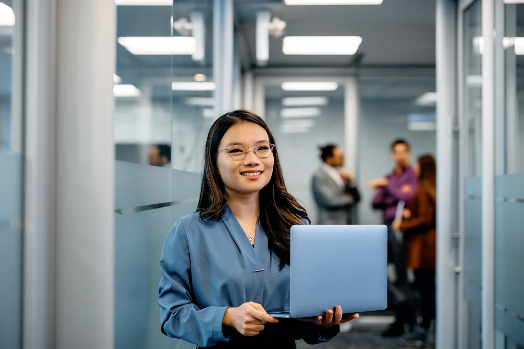 Entry-Level Workers Turkey Asian Woman holding a laptop